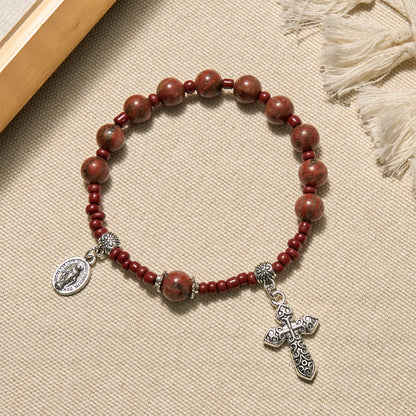 Bransoletka z dziesiątką różańca z czerwonego kamienia sezamowego o średnicy 8 mm z Cudownym Medalikiem i Krzyżem