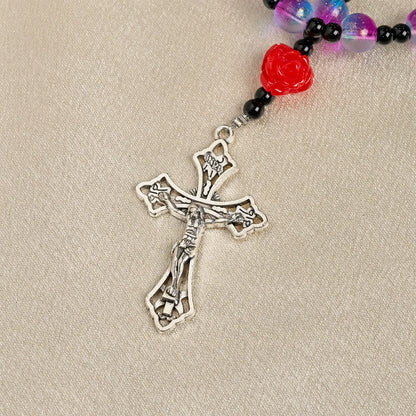Mistyczny, matowy, fioletowo-niebieski różaniec z czerwonymi różami i cudownym medalikiem błogosławieństwa