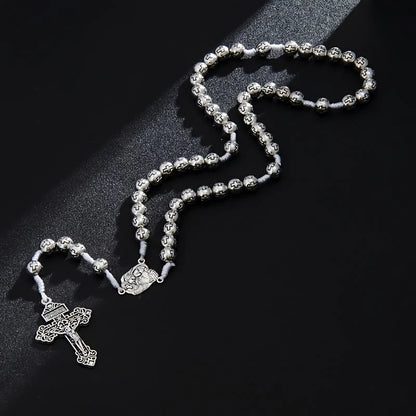 Centrum Świętej Rodziny Różaniec z krucyfiksem i koralikami z grawerunkiem krzyża: Symbol świętego